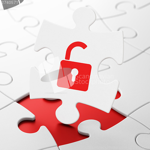 Image of Security concept: Opened Padlock on puzzle background