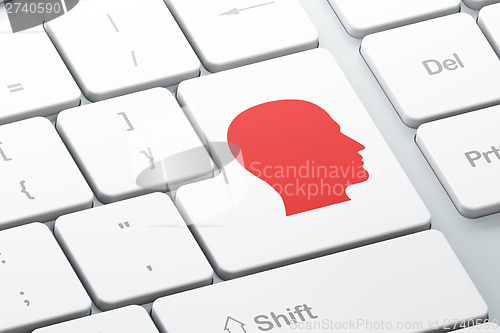 Image of Education concept: Head on computer keyboard background