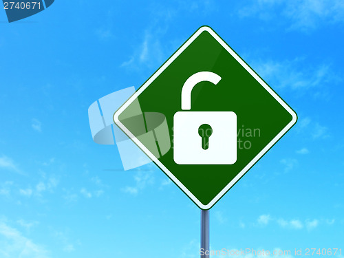 Image of Safety concept: Opened Padlock on road sign background