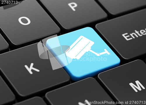 Image of Protection concept: Cctv Camera on computer keyboard background