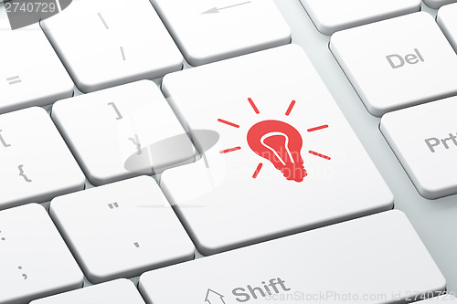 Image of Finance concept: Light Bulb on computer keyboard background