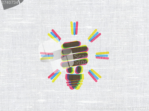 Image of Business concept: Energy Saving Lamp on fabric texture