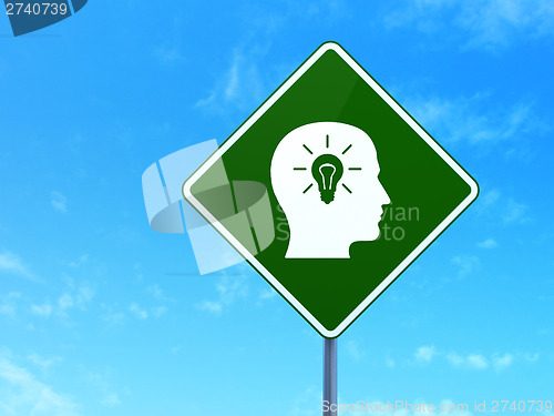Image of Marketing concept: Head With Light Bulb on road sign background