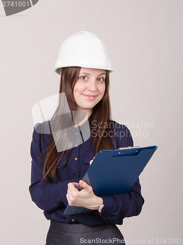 Image of Young woman in helmet records customer's needs