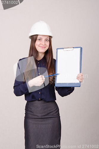 Image of Beautiful girl shows a pencil inscription on folder