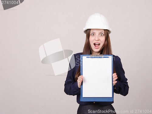 Image of Girl shocked by inscription on sheet in folder