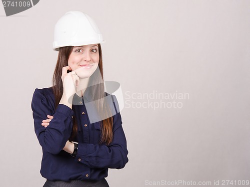 Image of Portrait a beautiful young girl in helmet of twenty-five