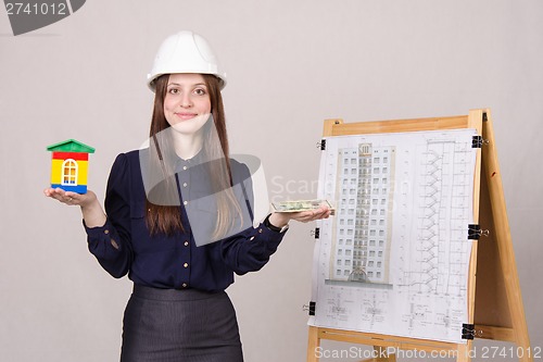 Image of Girl advertises multi-storey building under construction