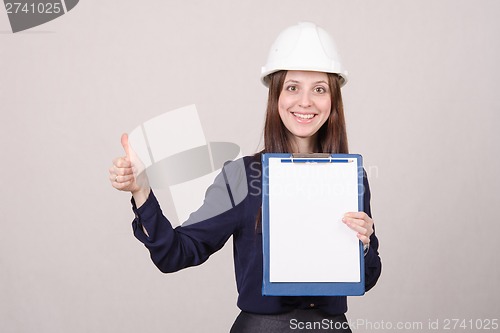 Image of Girl a helmet standing with folder in hand