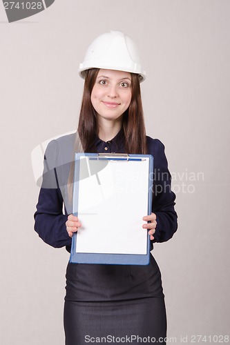 Image of Beautiful girl helmet with a folder in hands