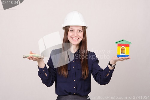 Image of Young girl predlyagaet buy a house