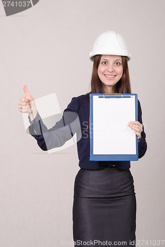 Image of Girl in helmet standing with a folder hand