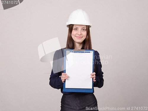 Image of Girl a helmet standing with folder and leaf in it