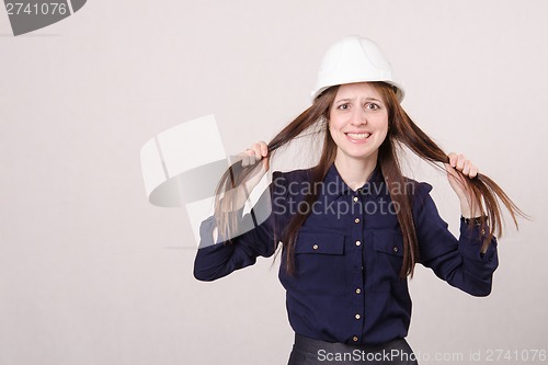 Image of Young girl in shock tearing my hair out