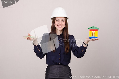 Image of Girl realtor offers to buy a house