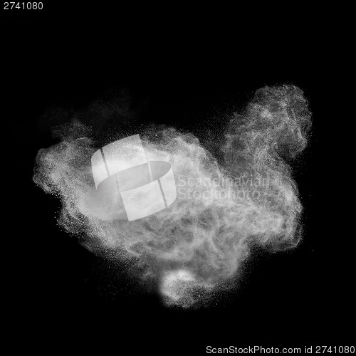 Image of White powder explosion isolated on black