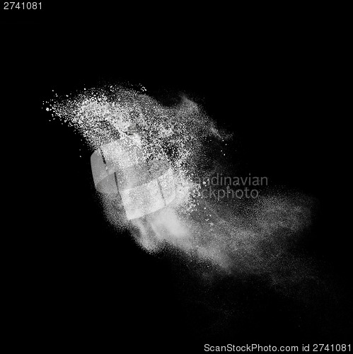 Image of White powder explosion isolated on black