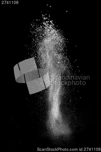 Image of White powder explosion isolated on black