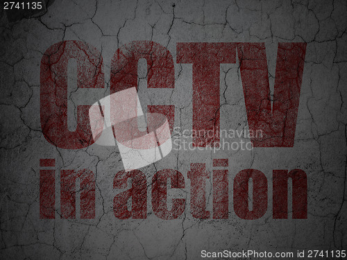 Image of Protection concept: CCTV In action on grunge wall background