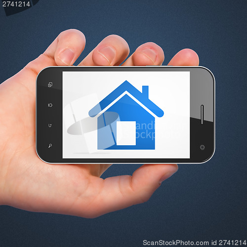 Image of Finance concept: Home on smartphone