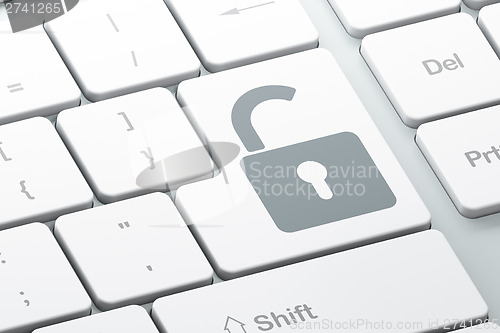 Image of Safety concept: Opened Padlock on computer keyboard background