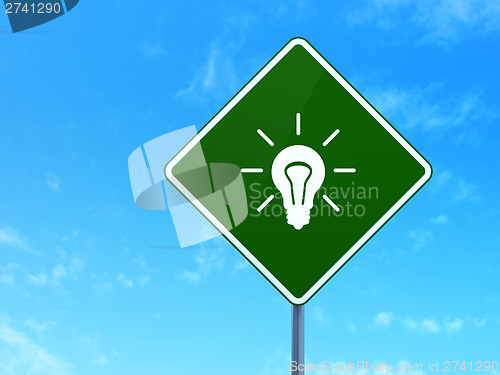 Image of Finance concept: Light Bulb on road sign background