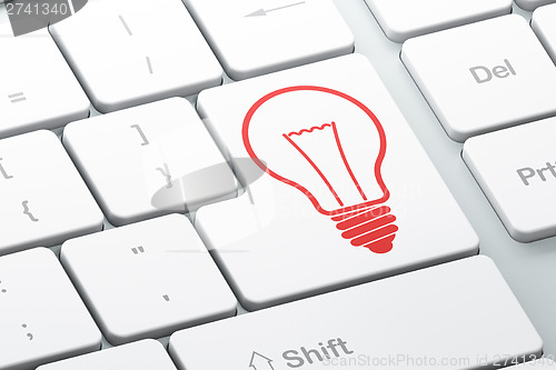 Image of Business concept: Light Bulb on computer keyboard background