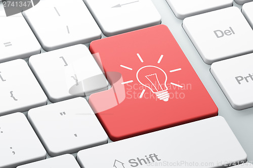 Image of Business concept: Light Bulb on computer keyboard background
