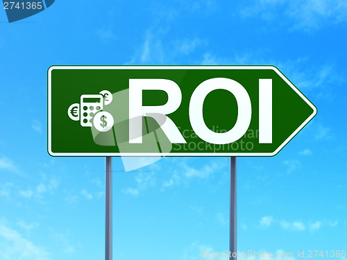 Image of Business concept: ROI and Calculator on road sign background