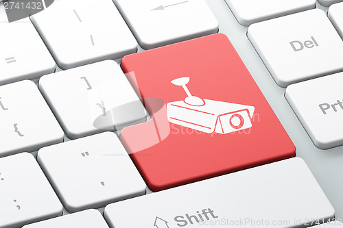 Image of Security concept: Cctv Camera on computer keyboard background