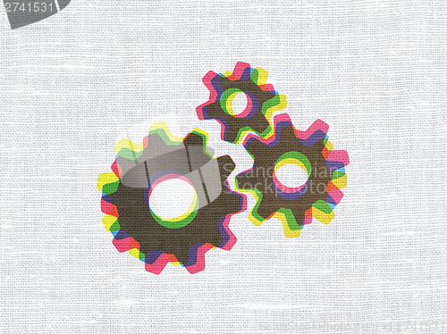 Image of Information concept: Gears on fabric texture background