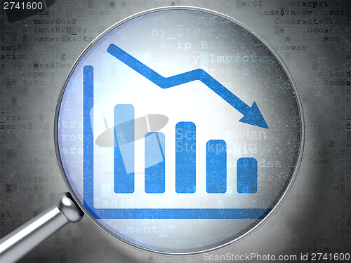 Image of Business concept:  Decline Graph with optical glass on digital b