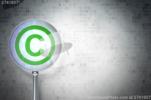 Image of Law concept:  Copyright with optical glass on digital background