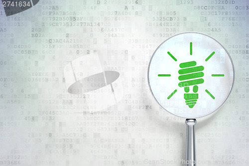 Image of Finance concept:  Energy Saving Lamp with optical glass on digit