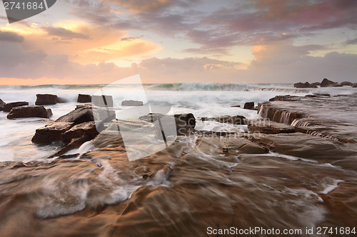 Image of Ocean surf and overflows at sunrise