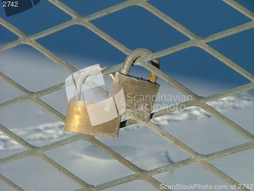 Image of customary (Estonian) wedding tradition padlock on a guard-rail of a bridge. Symbolizes commitment