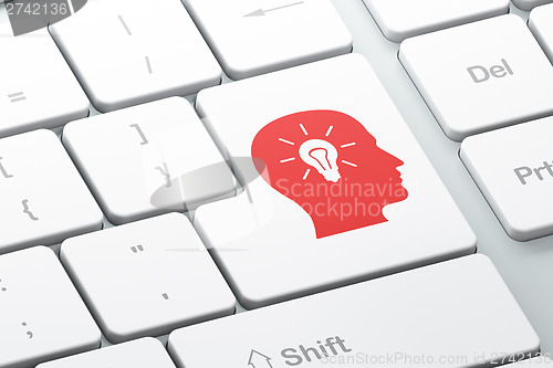 Image of Advertising concept: Head With Light Bulb on computer keyboard b