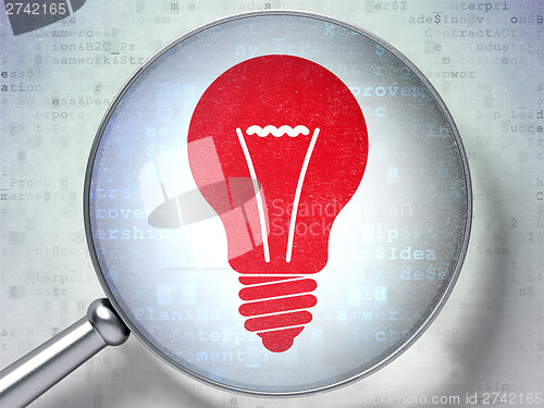Image of Finance concept:  Light Bulb with optical glass on digital backg