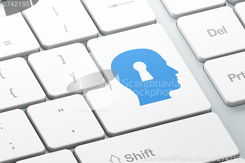 Image of Privacy concept: Head With Keyhole on computer keyboard backgrou