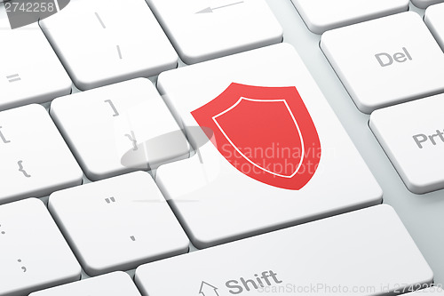 Image of Safety concept: Shield on computer keyboard background