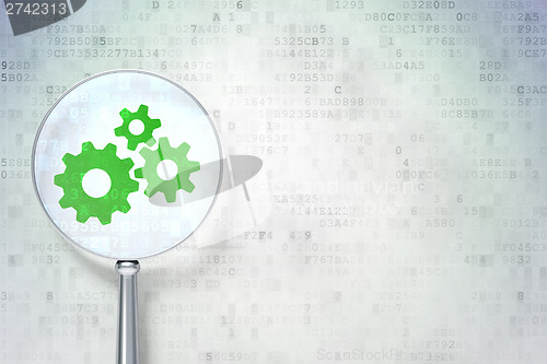 Image of Information concept:  Gears with optical glass on digital backgr