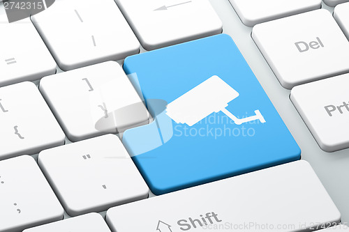 Image of Security concept: Cctv Camera on computer keyboard background