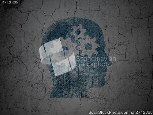 Image of Education concept: Head With Gears on grunge wall background