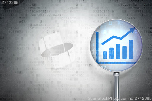 Image of Marketing concept:  Growth Graph with optical glass on digital b