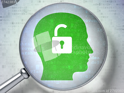 Image of Business concept:  Head With Padlock with optical glass on digit