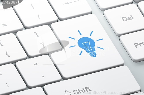 Image of Business concept: Light Bulb on computer keyboard background