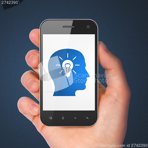 Image of Education concept: Head With Light Bulb on smartphone