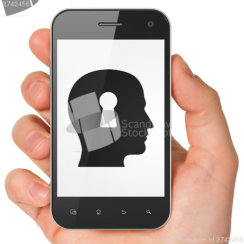 Image of Advertising concept: Head With Keyhole on smartphone