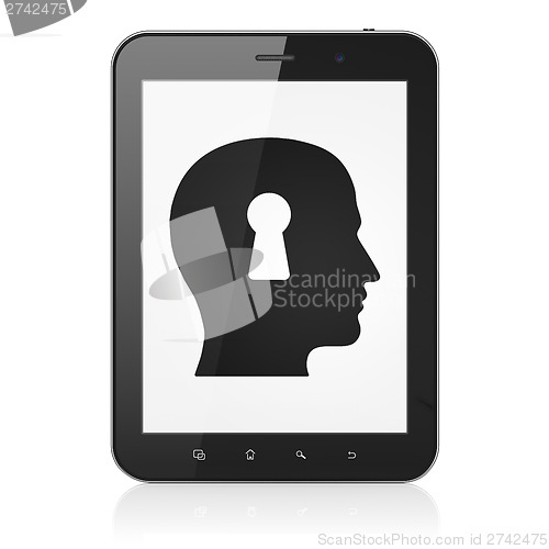 Image of Protection concept: Head With Keyhole on tablet pc computer