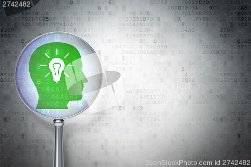 Image of Finance concept:  Head With Light Bulb with optical glass on dig